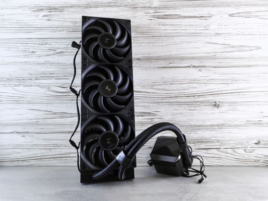 A high-performance cooling fan system for computers displayed on a wooden surface.